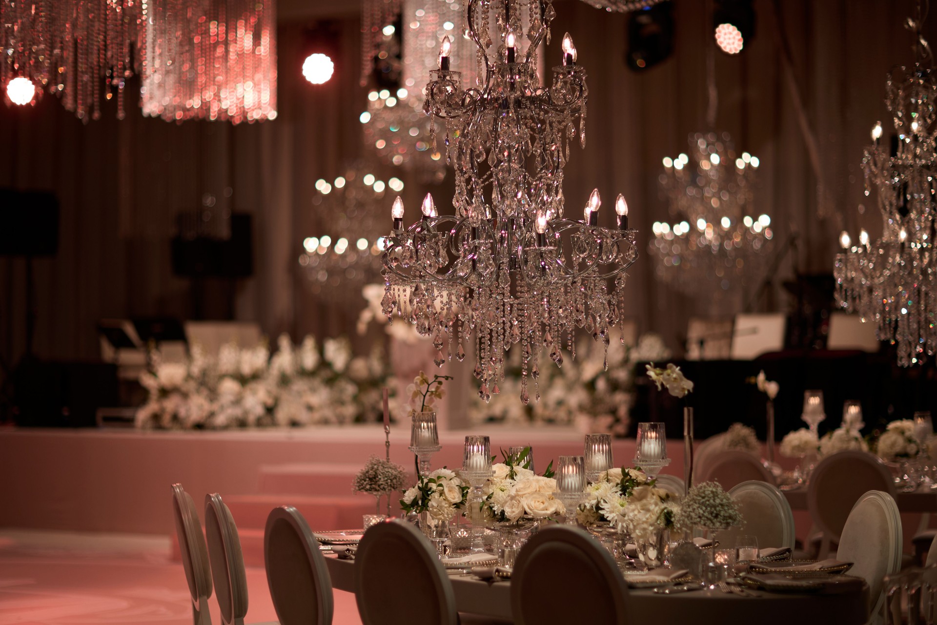 Elegant Wedding Table Setting with Crystal Chandelier. stock photo.