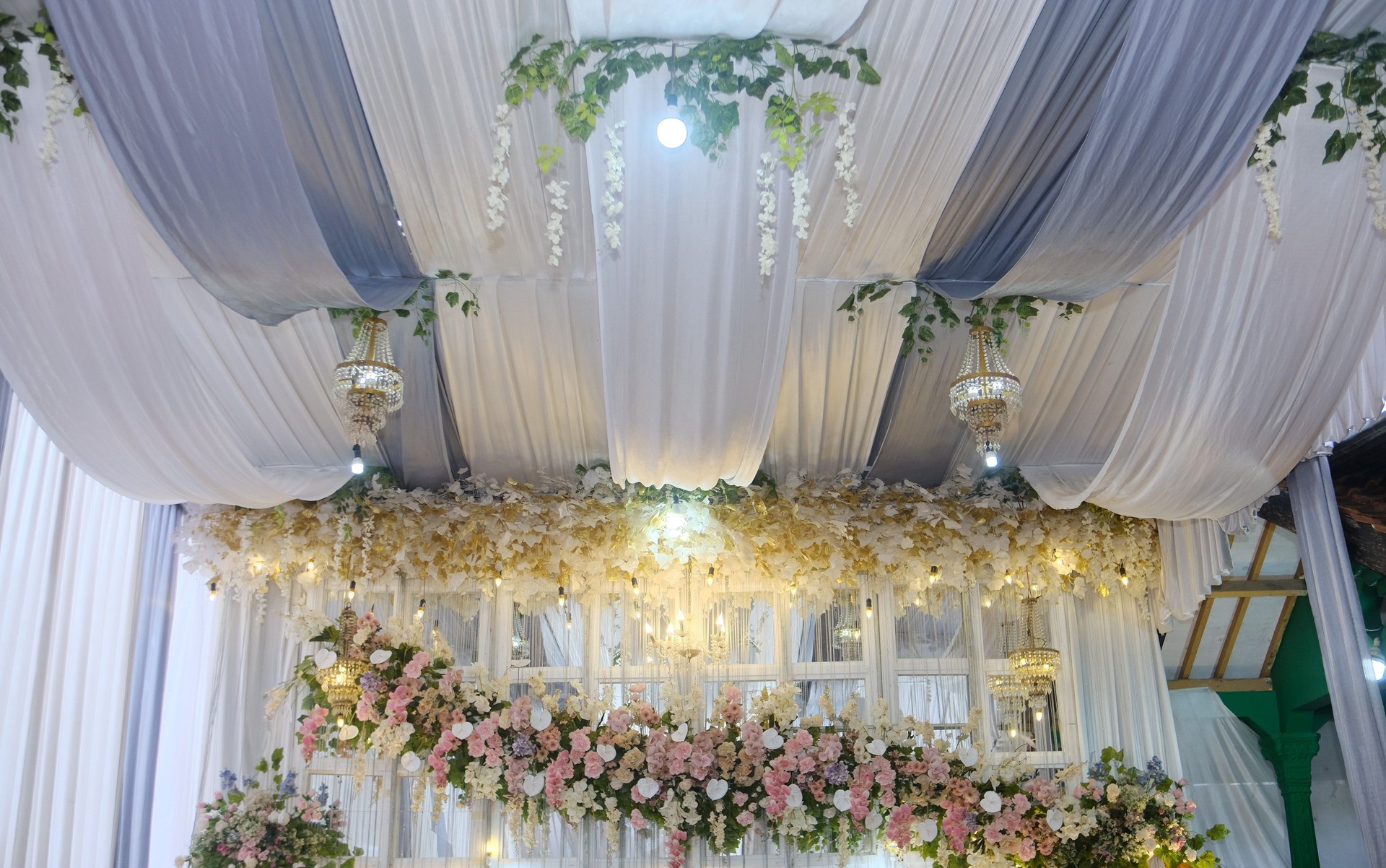 Elegant Floral Wedding Backdrop with Draped Ceiling and Chandelier Decorations